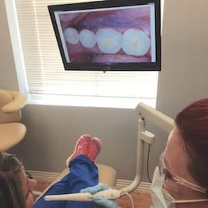 Our dentist gets a close up of a patient's teeth