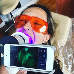 Velscope Light checking for oral cancer and tissue assessments