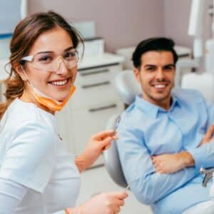 smiling dentist and patient